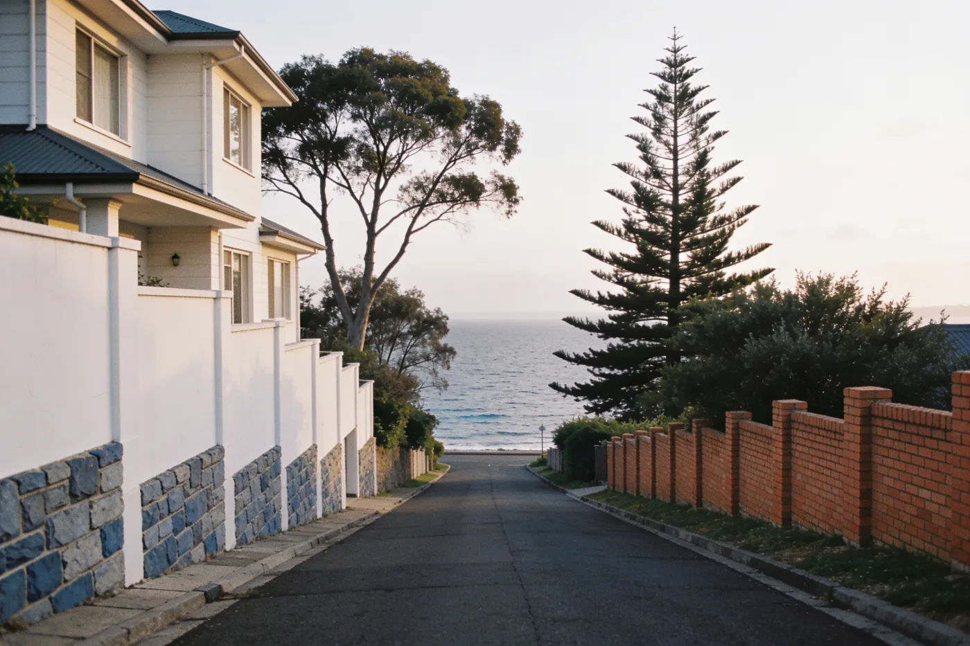 A bayside Melbourne street sloping down toward Port Phillip Bay